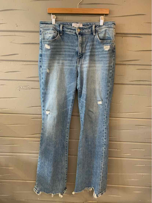 Blue distressed denim jeans with frayed hems and slight fading on thighs, size 16.