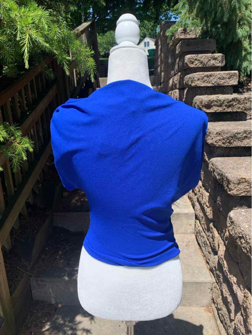 Bright blue fitted short-sleeve top with soft, stretchy fabric on white mannequin outdoors.
