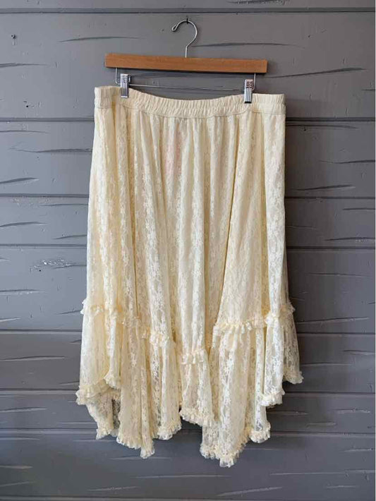 Cream-colored lace skirt with asymmetrical hem and gathered waist, size XL.