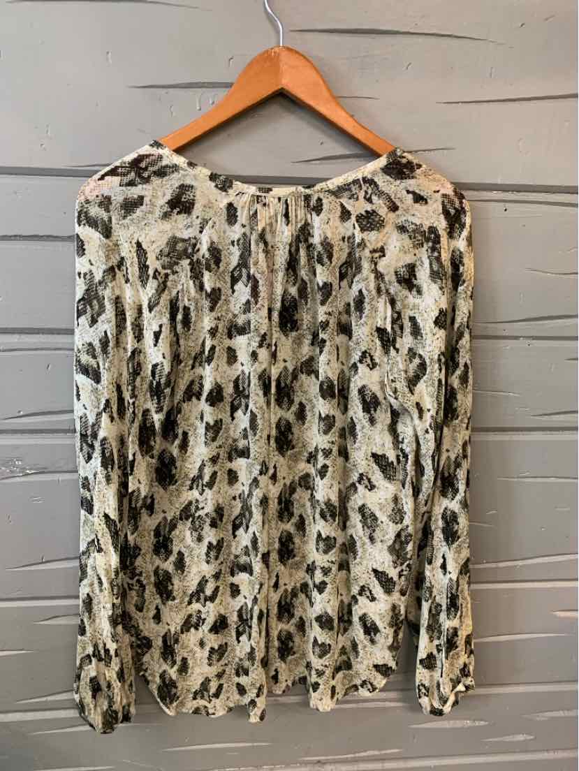 Long-sleeve blouse with green and black abstract snake print on cream background, lightweight fabric.