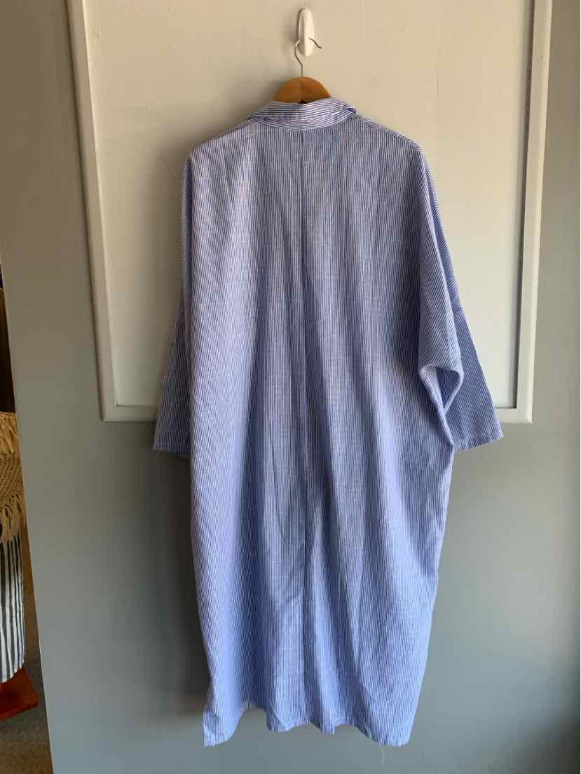 Loose-fitting long dress with blue and white vertical stripes, long sleeves, and a collar.