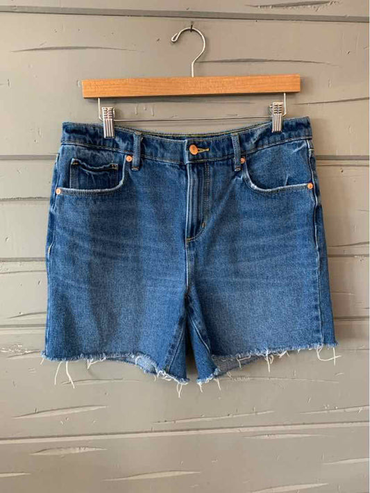 Blue denim shorts with frayed hems and classic five-pocket design, size 6.