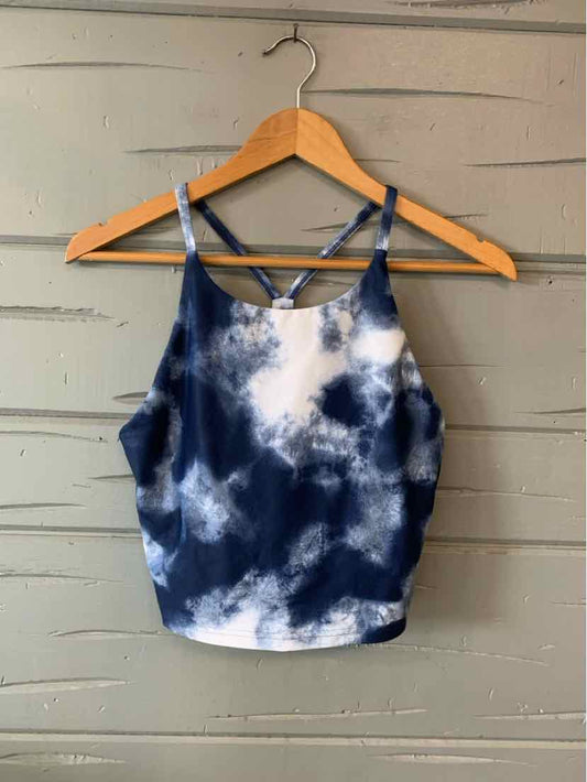 Navy and white tie-dyed cropped tank top with thin adjustable straps and a scoop neckline.