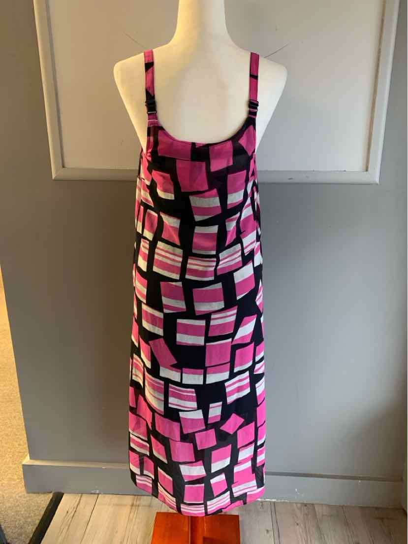 Sleeveless pink and black color block midi dress with adjustable straps on white mannequin.