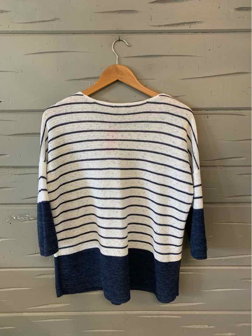 White and navy striped sweater with navy cuffs and hem, relaxed fit, long sleeves.