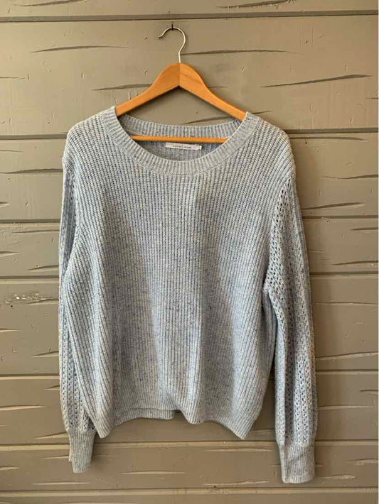 Light gray knit sweater with ribbed cuffs and hem, crew neckline, and relaxed fit in size XL.