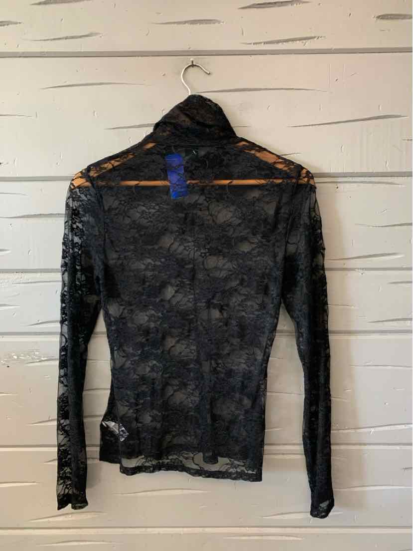 Black long-sleeve lace top with a sheer floral pattern and orange trim along the shoulders.