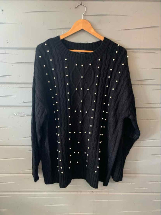 Black knit sweater with pearl embellishments and cable-knit pattern, size 18/20.