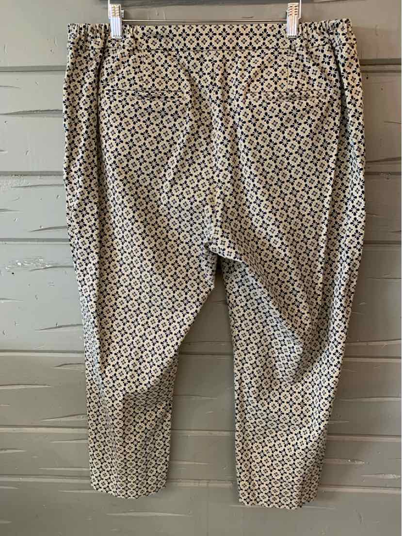 Tan patterned ankle-length pants with a relaxed fit and elastic waistband.