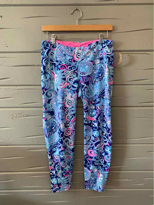 Women's large leggings with vibrant multicolor paisley pattern in shades of blue, pink, and purple with a pink waistband.