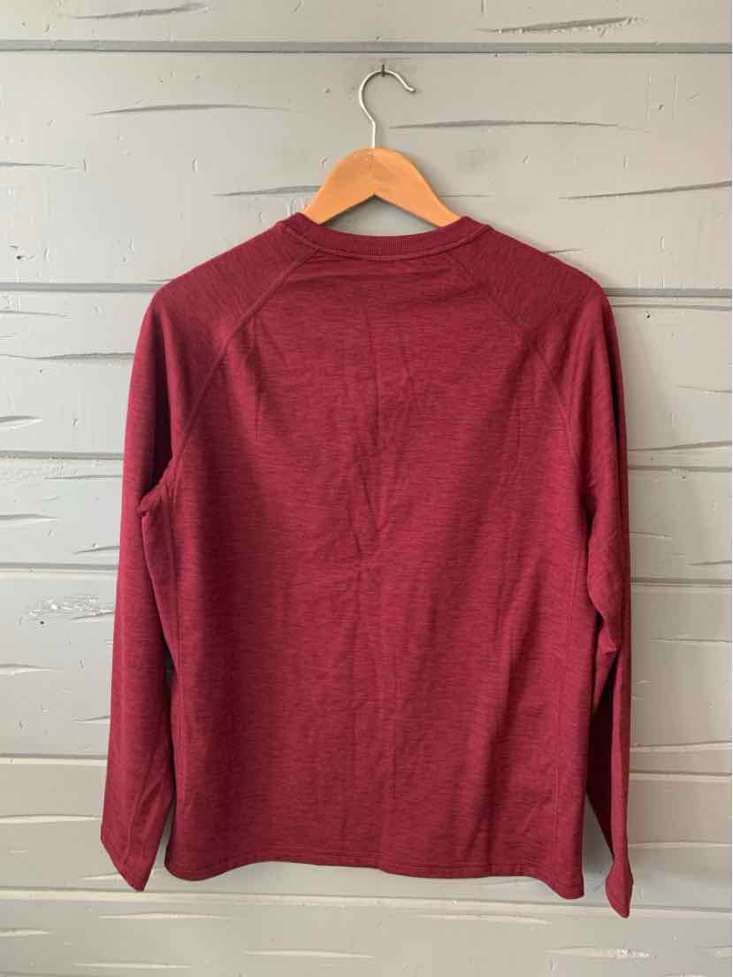 Long-sleeve solid burgundy crewneck shirt in medium size hanging on wooden hanger.
