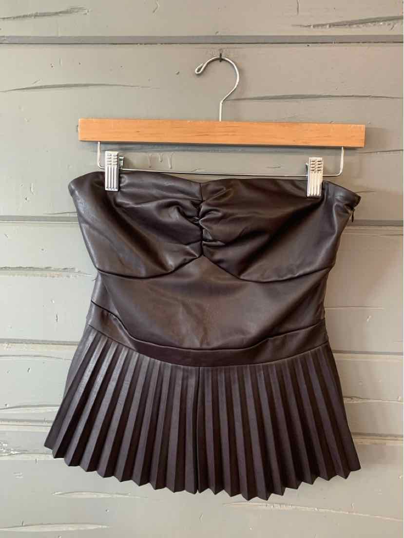 Black faux leather scoop neck mini skirt with pleated hem and ruched detail at waist.