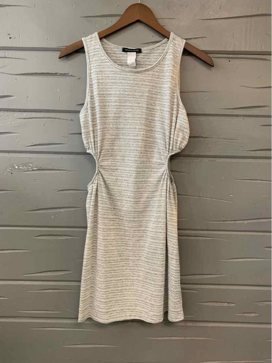 Gray sleeveless dress with subtle horizontal stripes and a fitted waist hanging on wooden hanger.