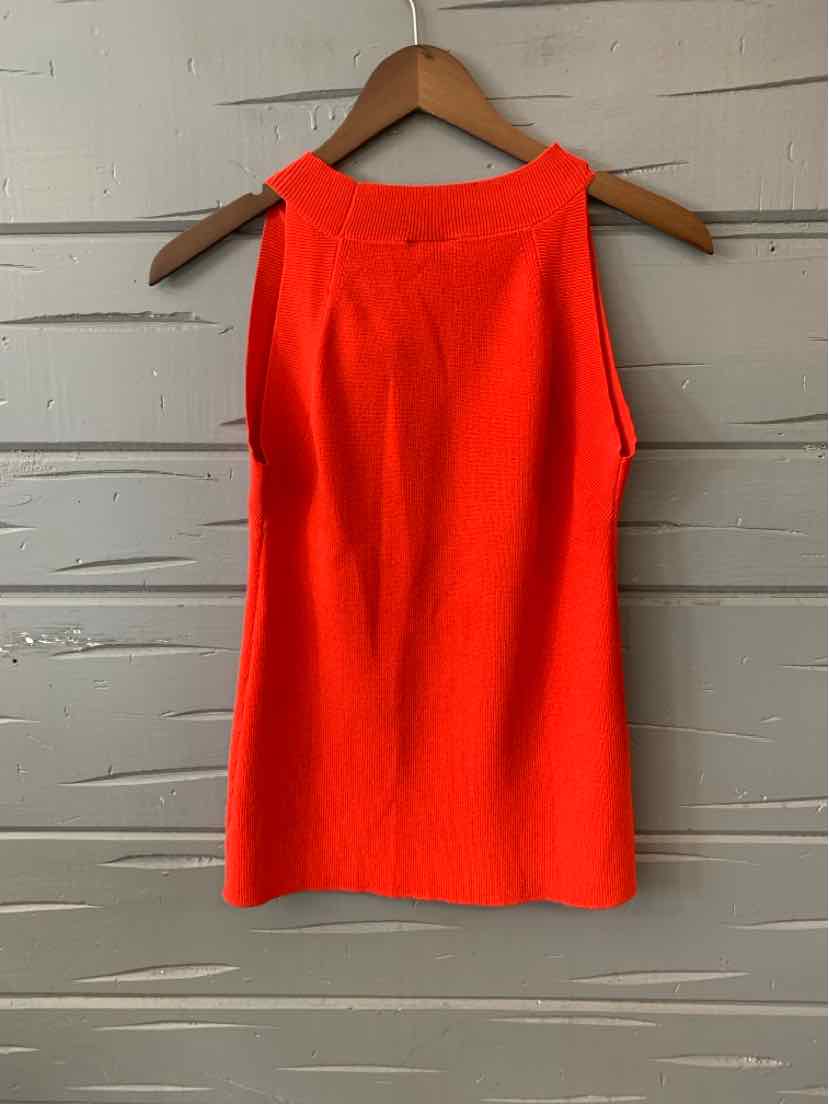 Bright red sleeveless knit top with a high neckline, medium size, hanging on wooden hanger.