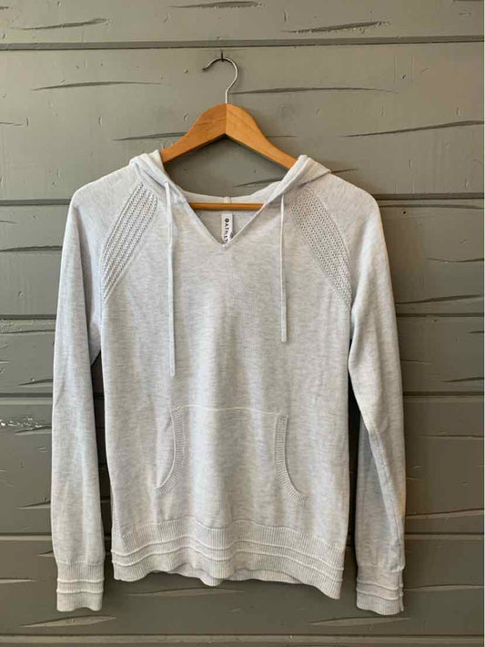 Light gray Athleta pullover hoodie with a drawstring neckline, long sleeves, and front kangaroo pocket.