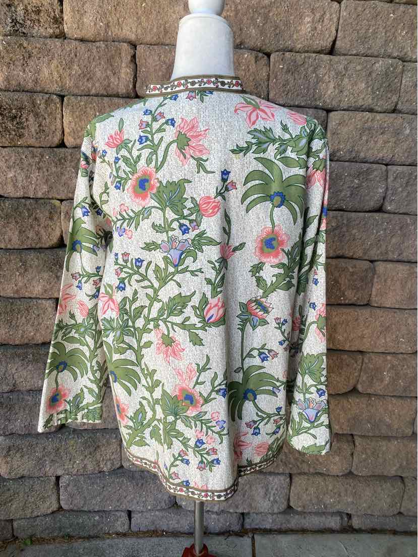 Long-sleeve floral blouse in off-white with green, pink, and blue flowers, XL size, with patterned trim at collar and hem.