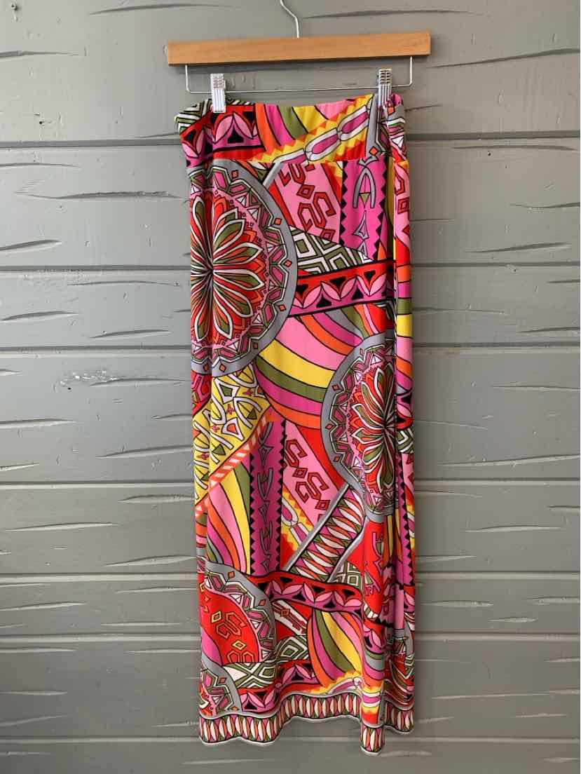Colorful bohemian maxi skirt with intricate pink, orange, and yellow geometric and floral patterns.