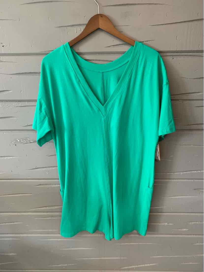 Bright green short-sleeve sweatshirt with a V-neck and relaxed fit on wooden hanger.