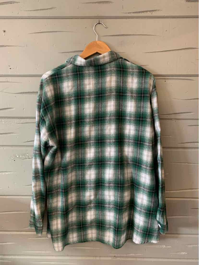 Long-sleeve green and white plaid button-up shirt in extra-large size hanging on wooden hanger.