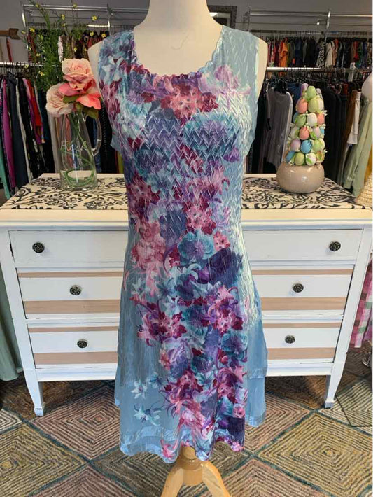Light blue sleeveless dress with purple and pink floral print, scoop neckline, knee-length hem.