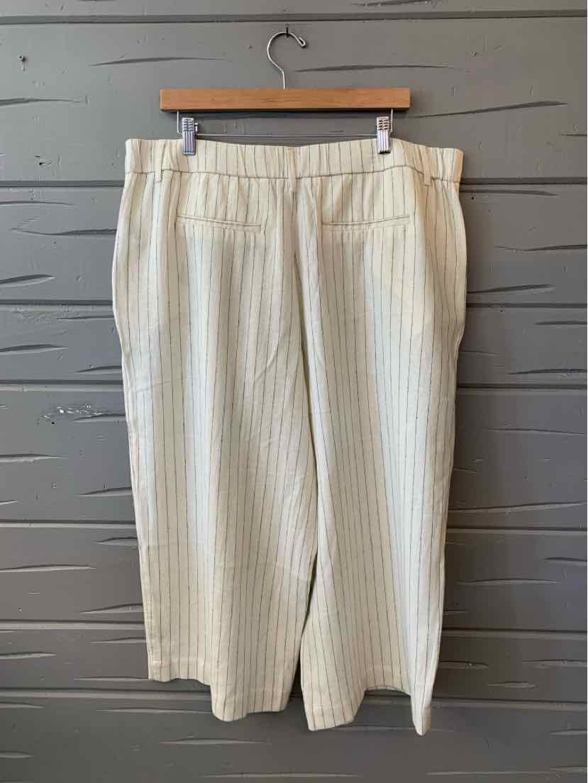 Cream wide-leg cropped pants with thin vertical beige stripes and an elastic waistband.