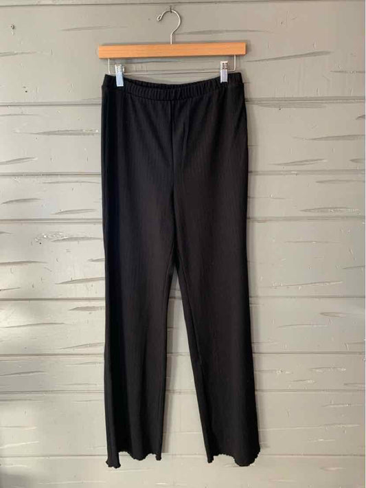 Black solid women’s pants with an elastic waistband and straight, relaxed legs.