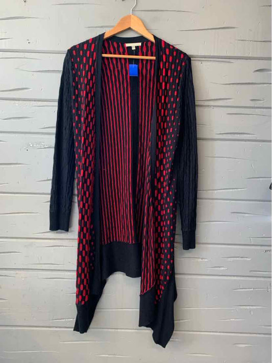 Women's long red and navy open-front knit cardigan with a geometric pattern and draped hem.