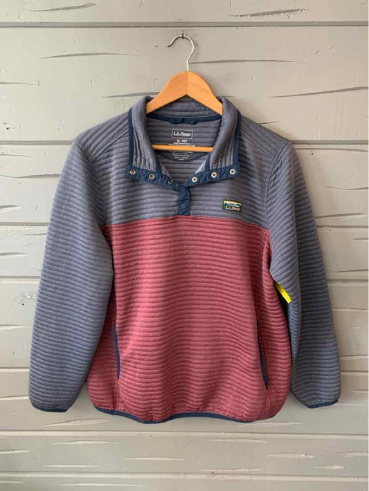 Gray and maroon color-blocked pullover sweater with quarter-zip and stand collar on wooden hanger.