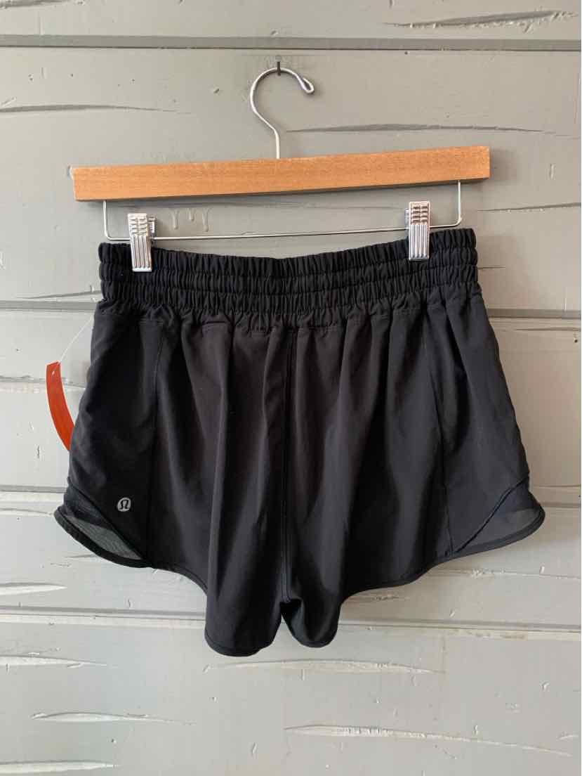 Black lightweight athletic shorts with elastic waistband and curved hem, size 6.