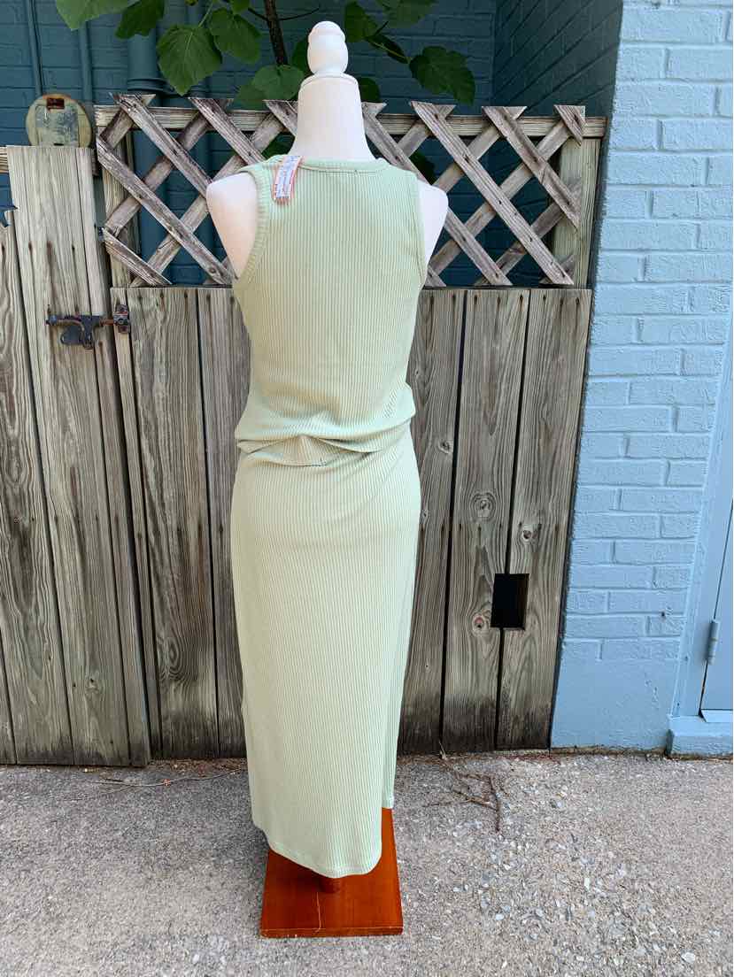 Light green sleeveless maxi dress with a fitted silhouette on a white mannequin.