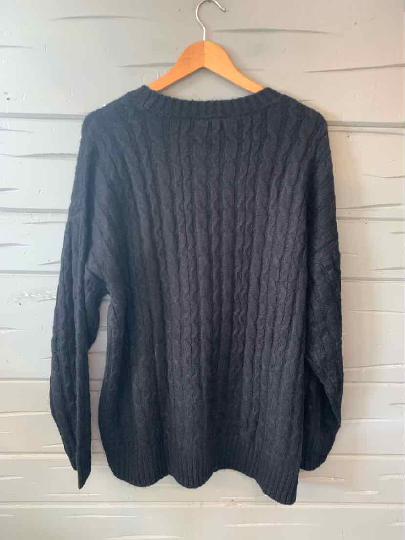Black cable knit long-sleeve sweater with crew neckline in size 18/20.
