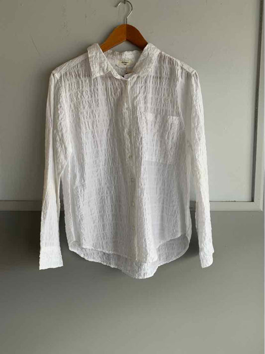 White long-sleeve button-up shirt with subtle texture and chest pocket, size small.