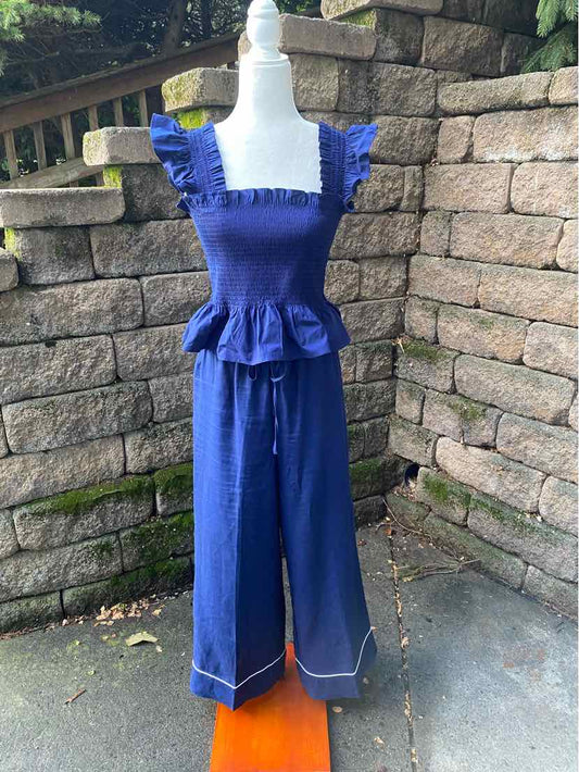 Navy blue two-piece set with ruffled square neckline top and wide-leg pants with white stitching.