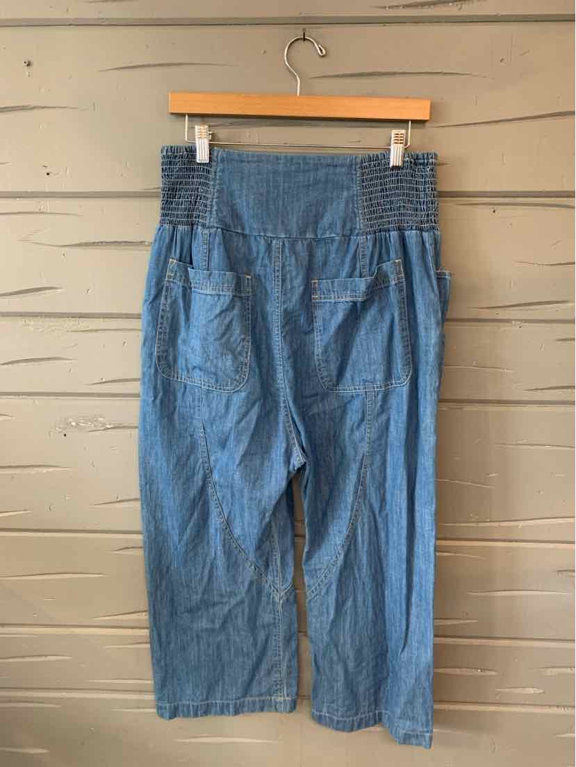 Blue chambray wide-leg cropped pants with gathered elastic waistband and front pockets.