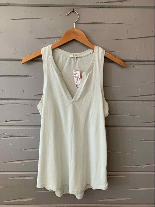 Light sage green sleeveless V-neck tank top with relaxed fit on wooden hanger.