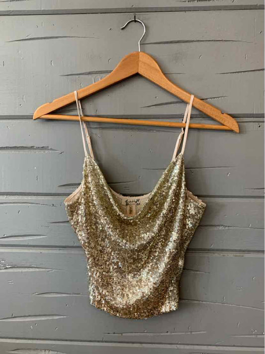Gold sequin cropped camisole with thin adjustable spaghetti straps and a draped neckline.