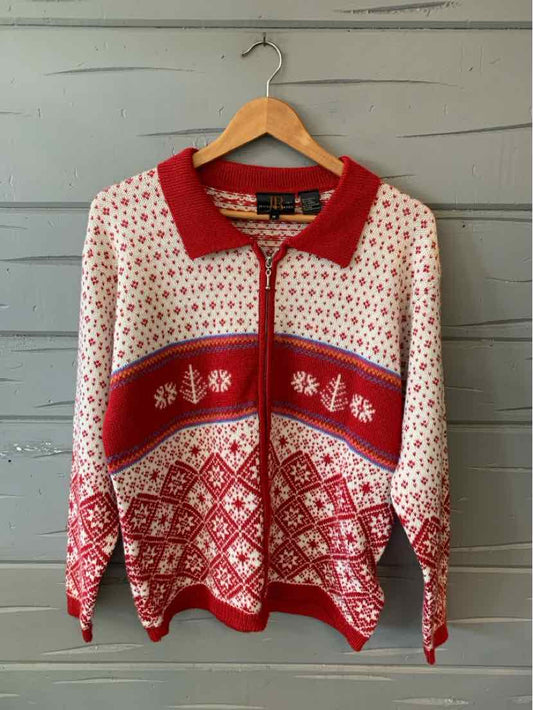 Red and white patterned knit sweater with zipper and red collar, size medium.