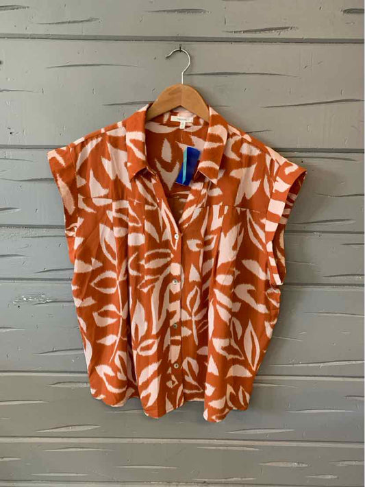 Brown and white zebra print sleeveless button-up blouse with collar in size XXL.
