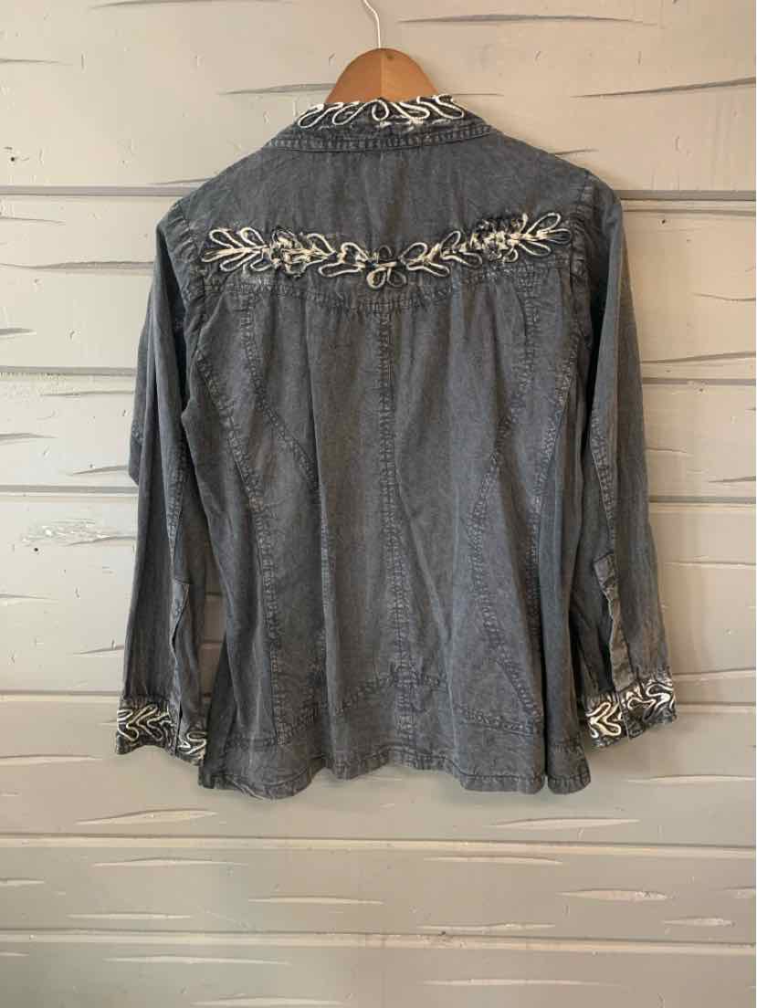 Black long-sleeve shirt with parsley and sage embroidery on back yoke and cuffs.