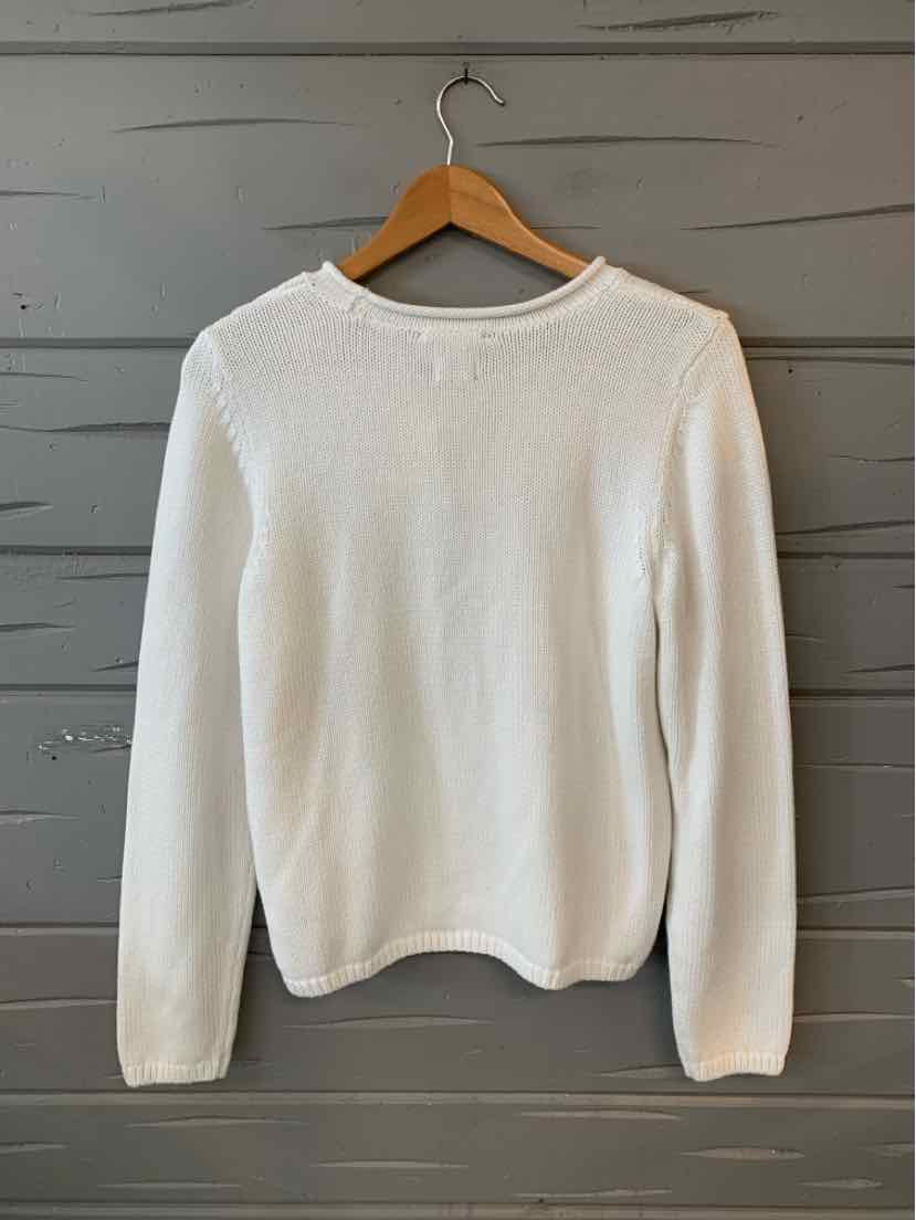 White long-sleeve knit sweater with crew neck, medium size, displayed on wood hanger.