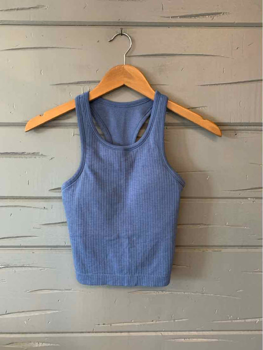 Blue ribbed knit sleeveless crop tank top with wide straps on wooden hanger.