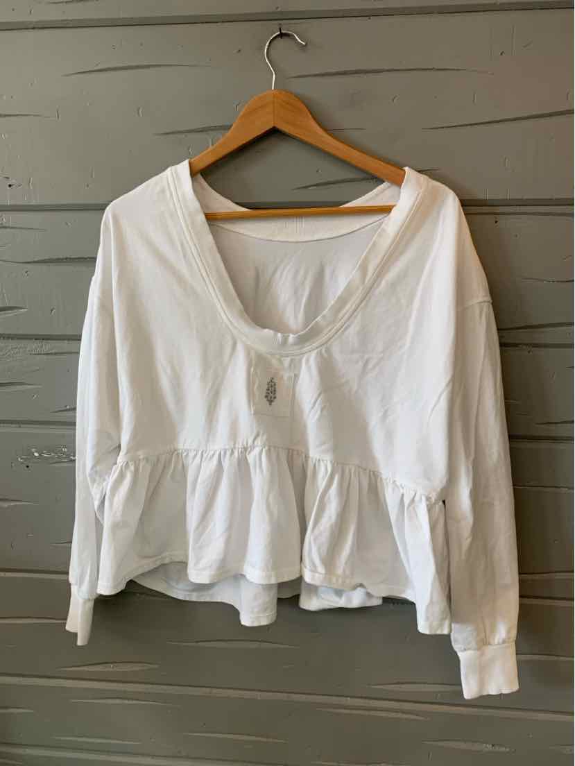 White long-sleeve peplum blouse with scoop neck and ruched front detail, lightweight fabric.
