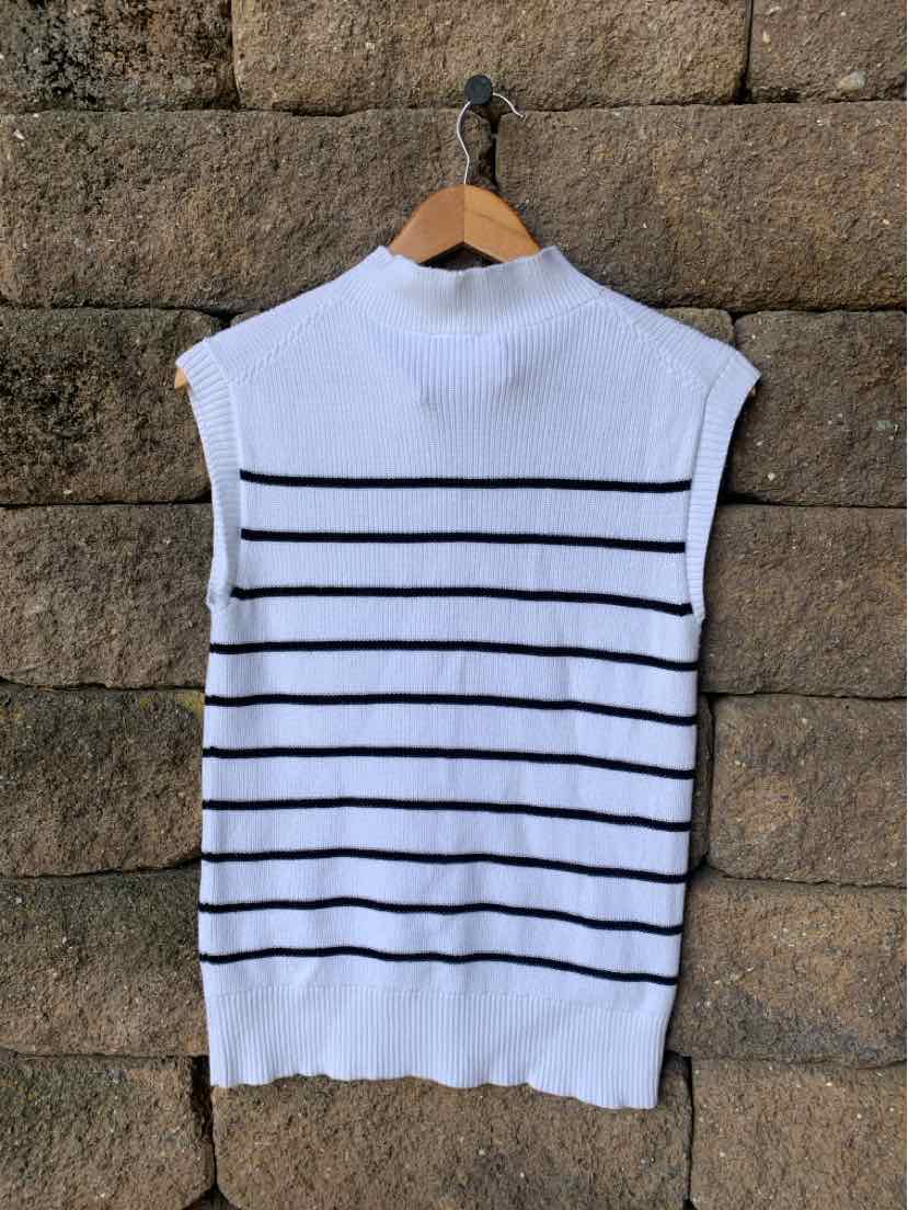 White sleeveless knit top with black horizontal stripes and ribbed high neck and hem.