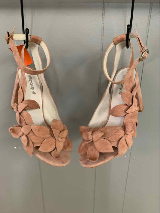 Tan suede open-toe sandals with floral embellishments and ankle straps, size 9.5.