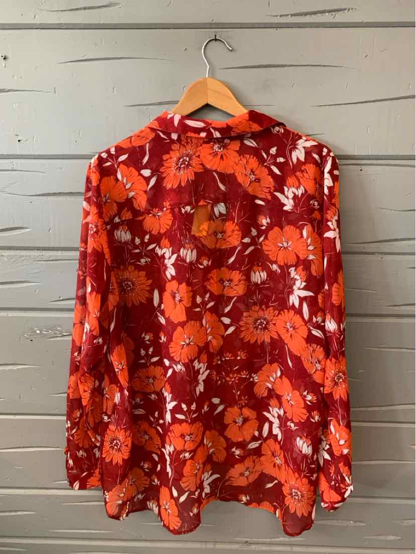 Red floral long-sleeve blouse with orange and white flower patterns, size XL, hanging on wooden hanger.