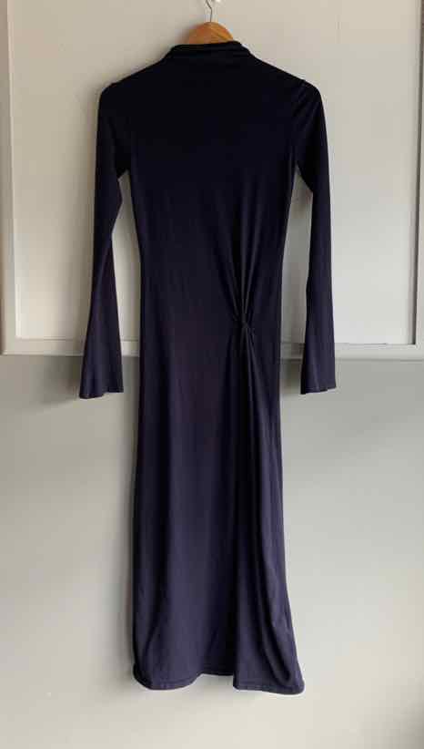 Black long-sleeve Zara maxi dress with a high neckline and fitted waist.