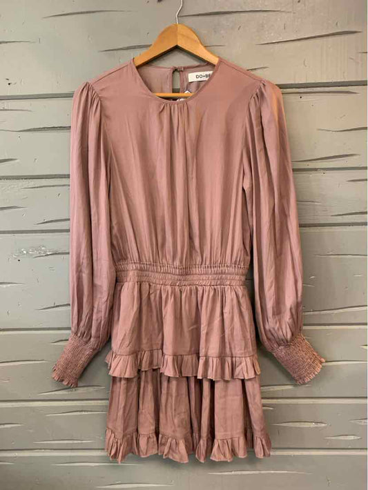 Lavender long-sleeve dress with pleated skirt and cinched waist detailing.