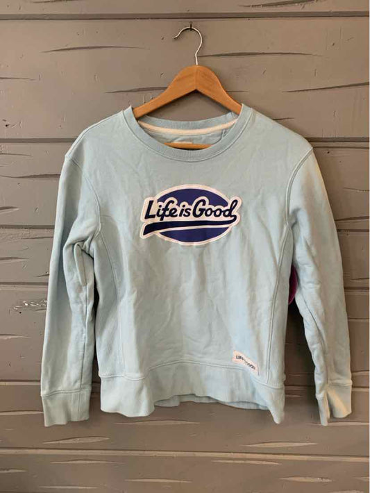 Light blue women's crewneck sweatshirt with "Life is Good" graphic on front and ribbed cuffs.