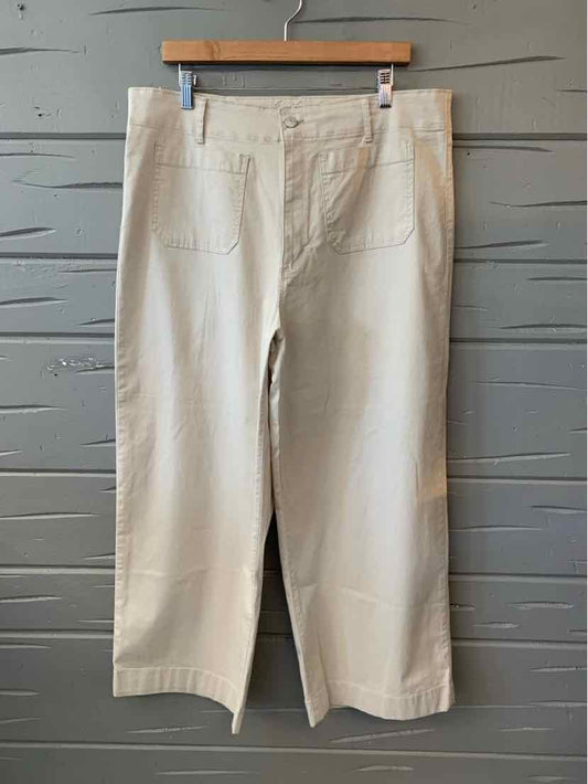 Tan wide-leg cropped pants with front pockets and button closure, size 16.