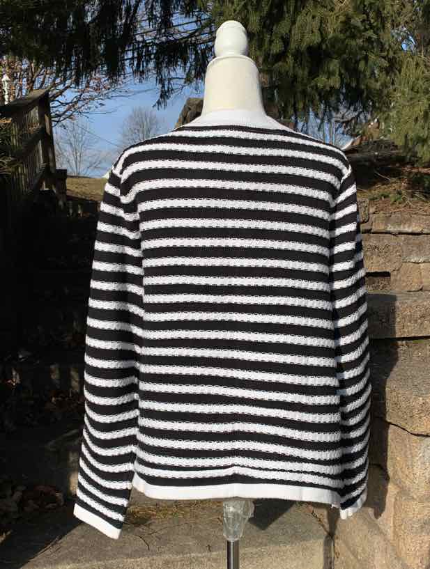 Black and white striped long-sleeve sweater in size 2X on mannequin against outdoor background.